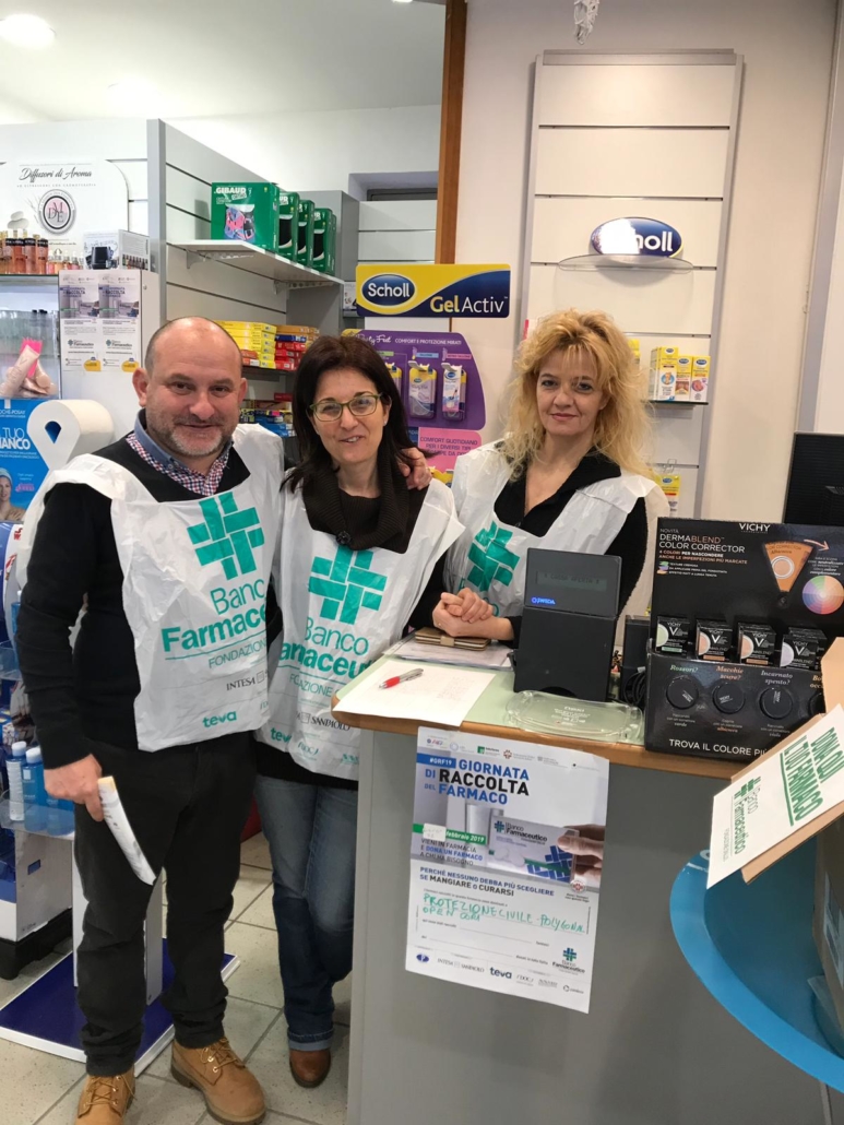 Volunteers in a pharmacy collecting medicines for dis-empowered groups